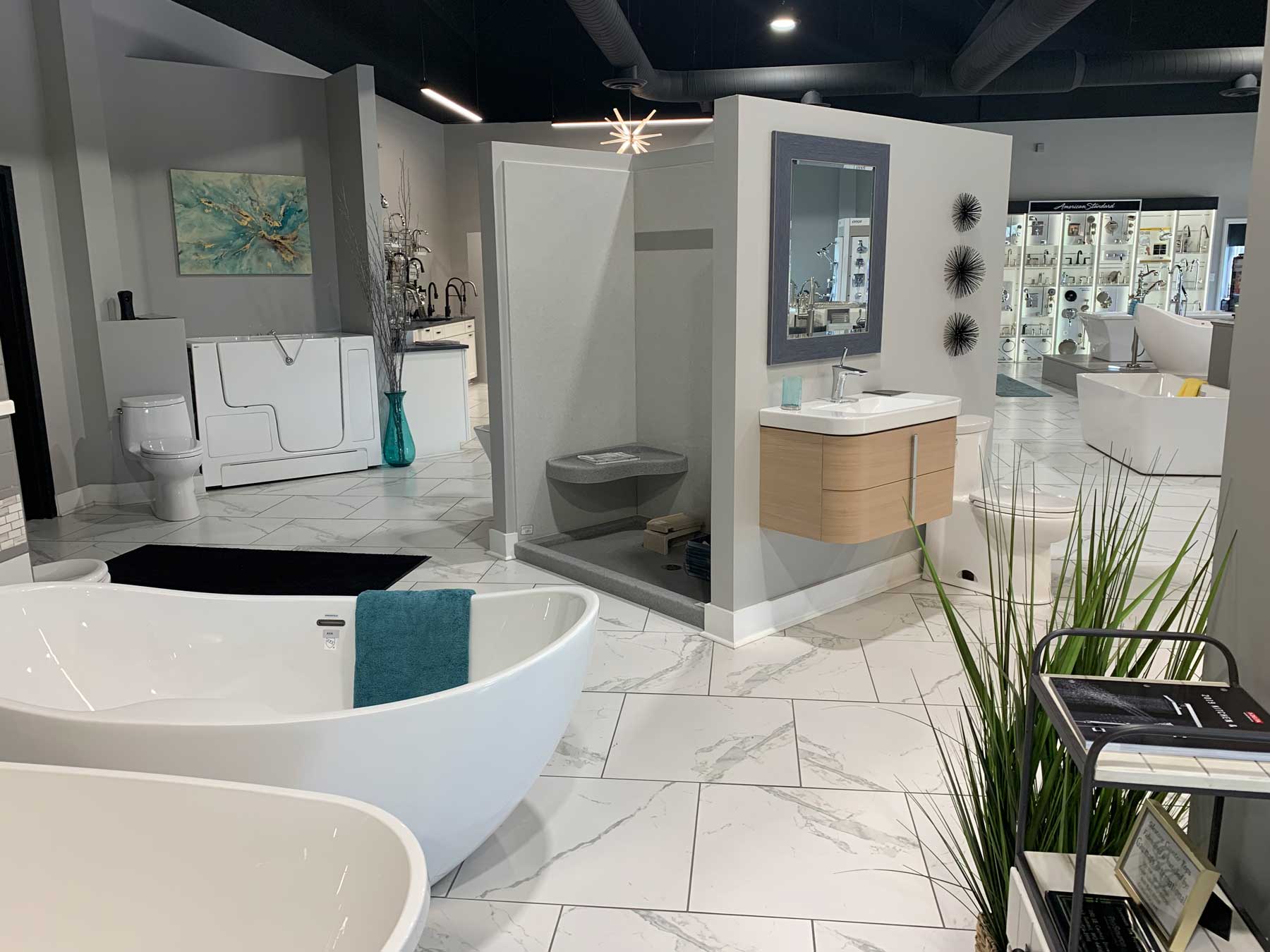 A spacious bathroom featuring a large tub and a stylish sink, creating a relaxing and functional space.